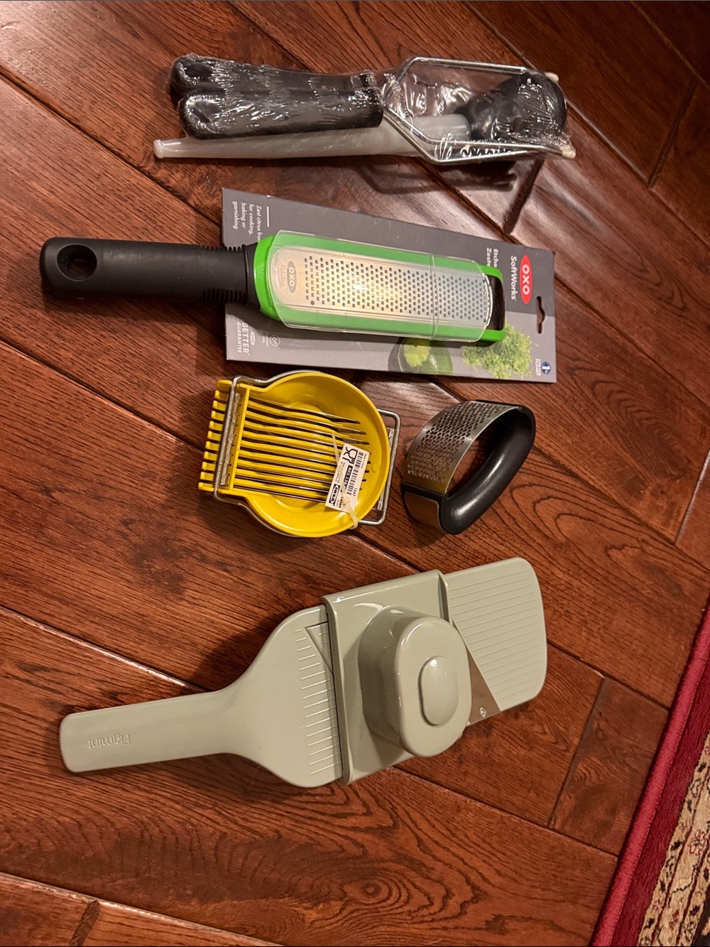 OXO Stainless Steel Grater with Green Accent and Black Handle and others